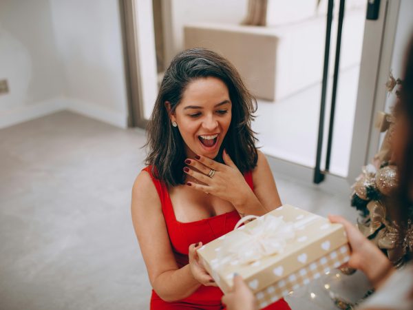 A happy woman accepting gift