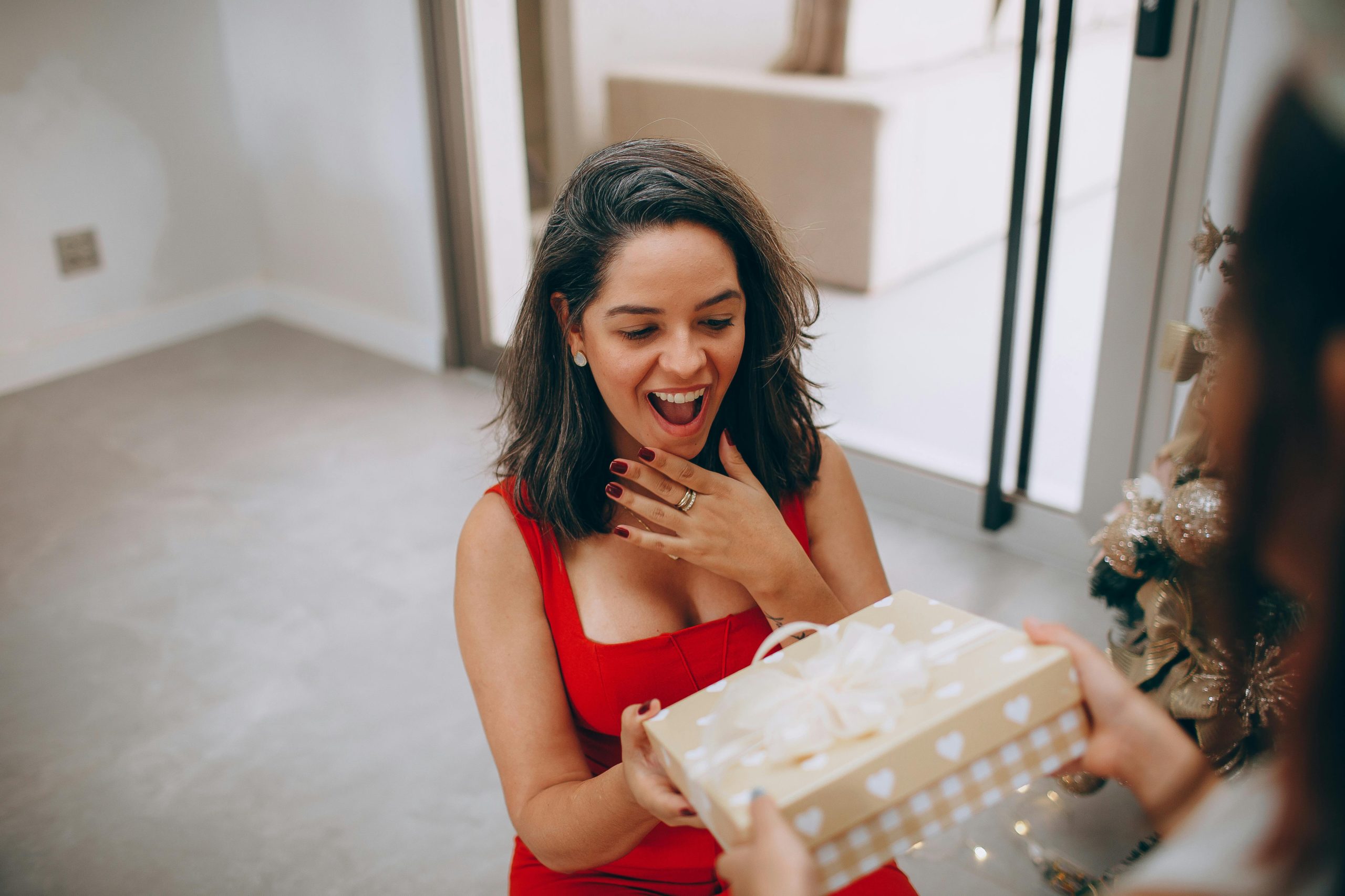 A happy woman accepting gift